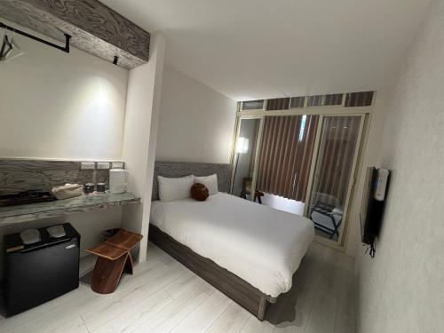 Voodi või voodid majutusasutuse Lai Jie Accommodation新北市民宿411號 toas