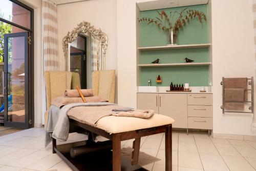 a bathroom with a table with a towel on it at Pezula Nature Retreat in Knysna