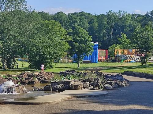 a park with a water fountain in a park at Chez CHARLETTE in Les Malots