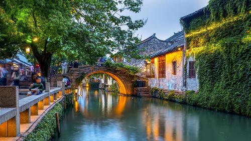 a bridge over a river in a city at Holiday Inn Express Suzhou East Taihu by IHG in Suzhou