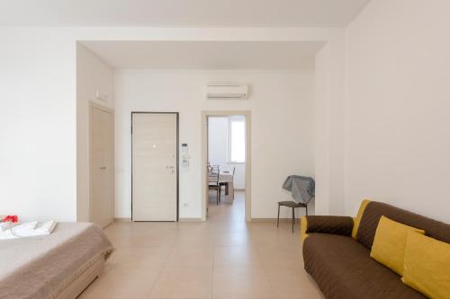 a living room with a couch and a table at Suite Ondina Viareggio Apartments in Viareggio