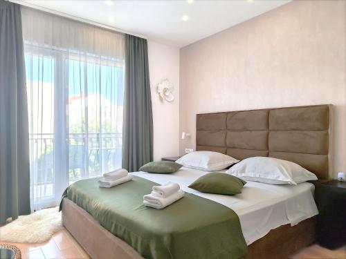Ένα ή περισσότερα κρεβάτια σε δωμάτιο στο Kaša Rooms 2
