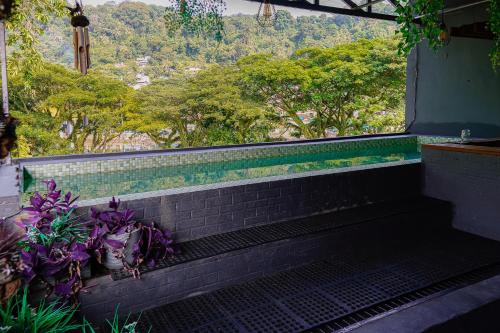 a set of stairs with a view of a mountain at Kokos Hostel Padang City in Padang