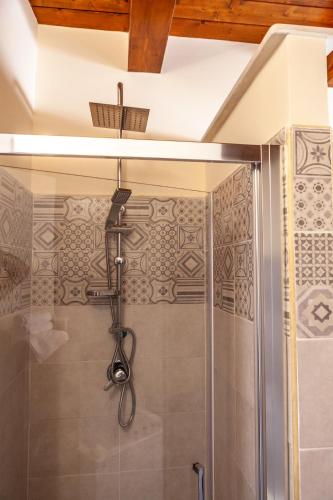 a shower with a shower head in a bathroom at B&B Piazza Noua 1831 in Sora