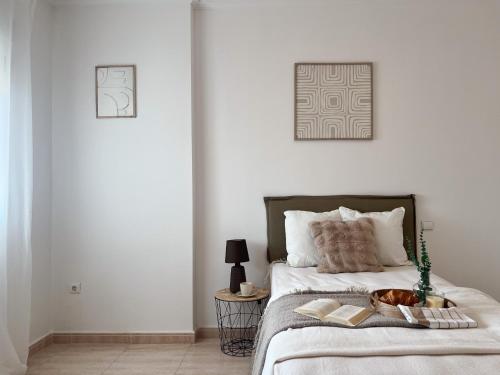 Ένα ή περισσότερα κρεβάτια σε δωμάτιο στο ArañueloHomes