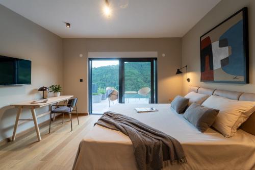 Ένα ή περισσότερα κρεβάτια σε δωμάτιο στο Villa Horto