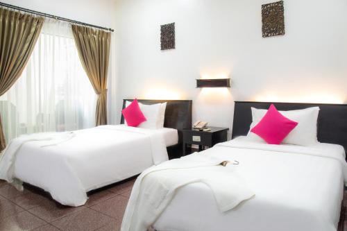 Katil atau katil-katil dalam bilik di The Oasis Harbor