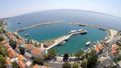 an aerial view of a harbor with boats in the water at Hotel Krilo in Podstrana