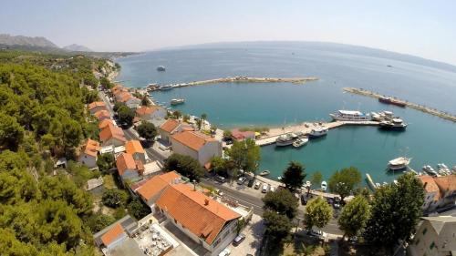 an aerial view of a harbor with boats in the water at Hotel Krilo in Podstrana