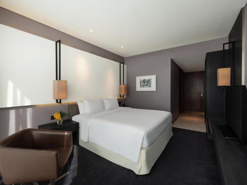 Voodi või voodid majutusasutuse Amara Bangkok Hotel toas