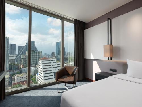 Voodi või voodid majutusasutuse Amara Bangkok Hotel toas