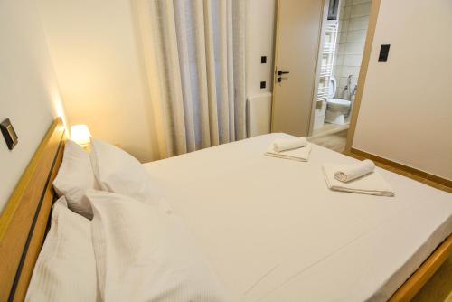Ένα ή περισσότερα κρεβάτια σε δωμάτιο στο Serenity Residence