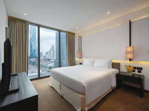 Voodi või voodid majutusasutuse Amara Bangkok Hotel toas