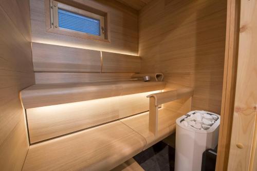 a small bathroom with a toilet and a window at Pärjä Suites 3 in Syöte