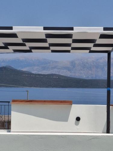 a black and white umbrella on top of a boat at 5th Continent in Nikiana