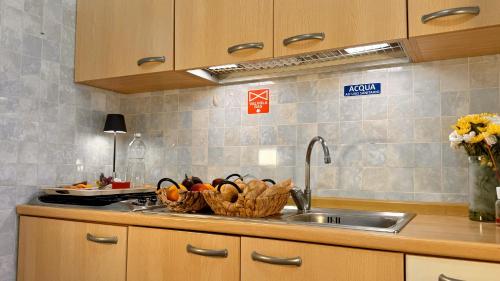 Dapur atau dapur kecil di Villaggio Idra residence