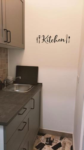a kitchen with a sink and a mirror on the wall at Cuore di Aci - Casa degli Zelanti in Acireale