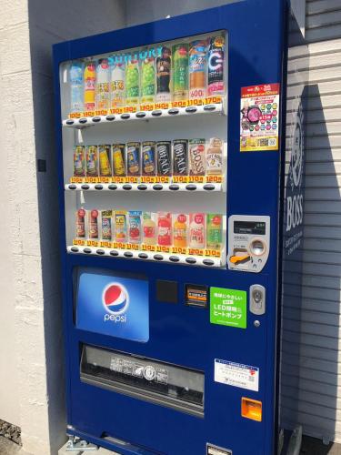 a vending machine filled with drinks and soda at Little Garden in Otaru