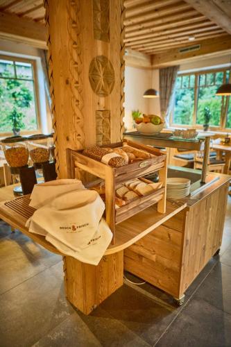 a room with a table with hats on it at Platzhirsch Rooms - B&B - SELF CHECK-IN in Piesendorf