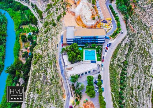 a model of a building with a train on a track at Hotel Spa Mirador in Jorquera