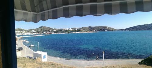 a view of a large body of water from a window at Studio Poseidon in Lipsoi