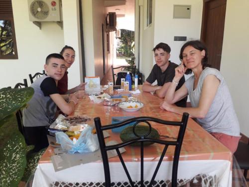 a group of people sitting around a table at Golden Residence in Anuradhapura