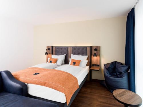 Cama o camas de una habitación en Holiday Inn - the niu, Saddle Fürth by IHG