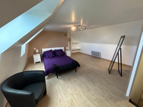 a bedroom with a purple bed and a couch at Le domaine du bez gite de Jules piscine,sauna,sauna,hammam,spa in Saint-Laurent-dʼOlt