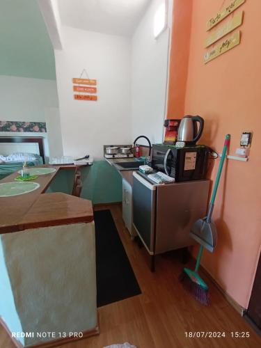 a kitchen with a counter and a stove in a room at Residencial María in Bombinhas