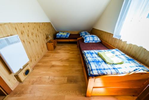 Postel nebo postele na pokoji v ubytování Ośrodek Wypoczynkowy WEZAJ