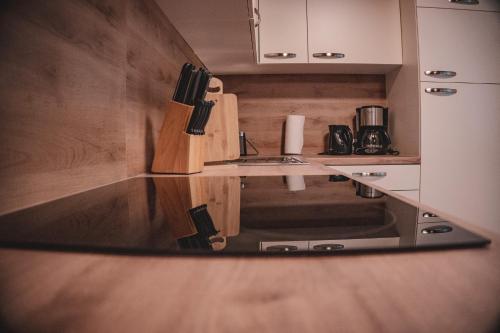a kitchen with a sink and a counter top at Haus Bergwind in Sankt Leonhard im Pitztal