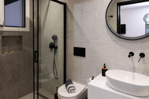 a bathroom with a sink and a shower at Irene Studios in Mastichari