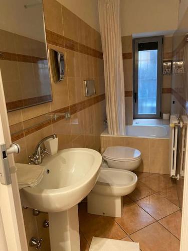 a bathroom with a sink and a toilet at Duomo Prestige in Milan