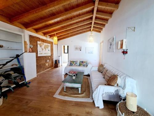 a living room with a couch and a table at Eco Casa Tierra in Tabayesco