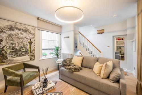 a living room with a couch and a chair at 2BR Harry Potter Inspired House - Covent Garden in London