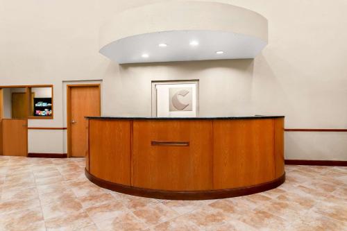 a lobby with a reception desk in a building at Comfort Suites Tampa Airport North in Tampa