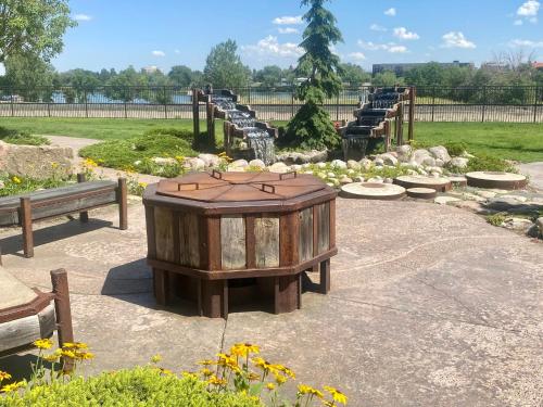 a seating area with benches and a wooden box at Staybridge Suites Great Falls by IHG in Great Falls