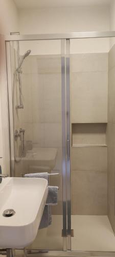 a bathroom with a white sink and a shower at Bordighera Castello Selva Dolce in Bordighera
