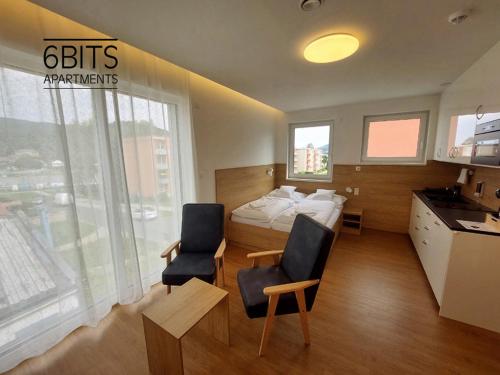 Postel nebo postele na pokoji v ubytování 6bits Apartments