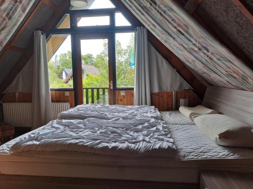 Ένα ή περισσότερα κρεβάτια σε δωμάτιο στο Bungalowpark in Nordholland