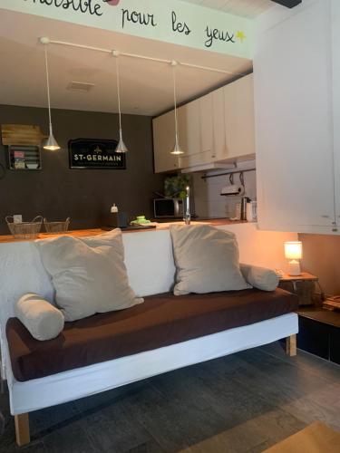 a couch with pillows on it in a kitchen at La Cata Country House in Patones