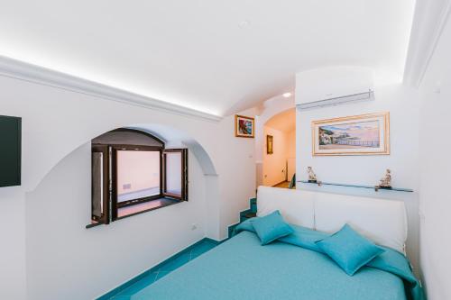 Postel nebo postele na pokoji v ubytování B&B IL CORTILE