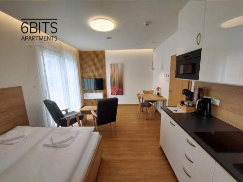 TV a/nebo společenská místnost v ubytování 6bits Apartments