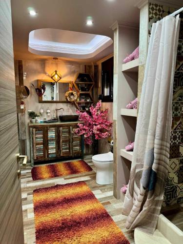 a bathroom with a toilet and a sink at Speranza's Sweet Home in Vrontados
