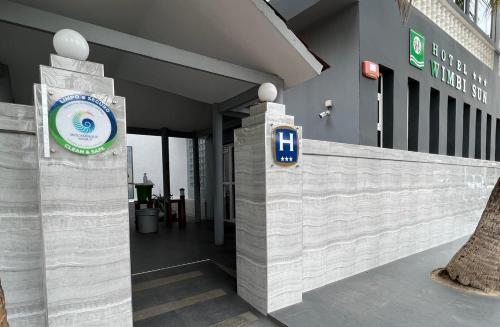 a building with a sign on the front of it at Hotel Wimbi Sun in Pemba