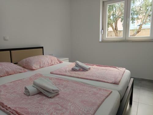 Katil atau katil-katil dalam bilik di Apartments Oleandar