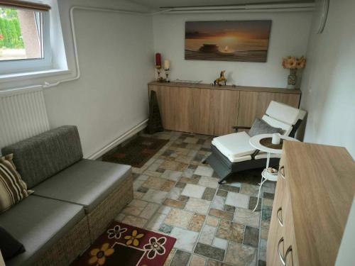 a living room with a couch and a table at Elpo House in Neveronys