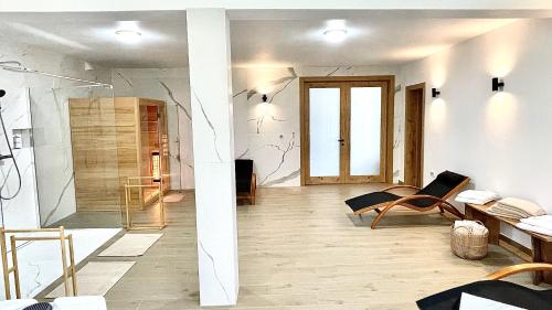 a living room with a couch and a table at REY Chalet in Vatra Dornei