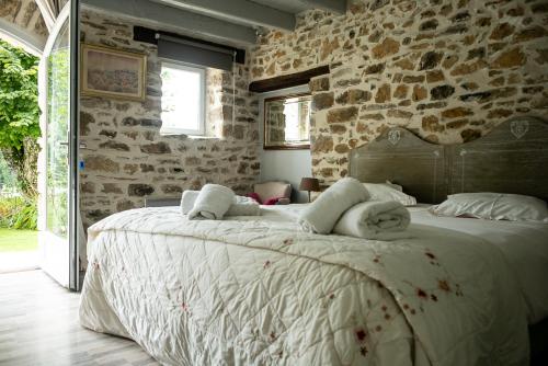 Postel nebo postele na pokoji v ubytování Gîte Les Dalias