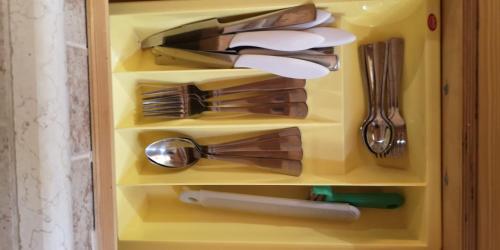 a drawer full of kitchen utensils at GIORGIa HOUSE in Matino